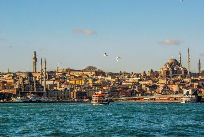 City buildings near body of water during daytime photo